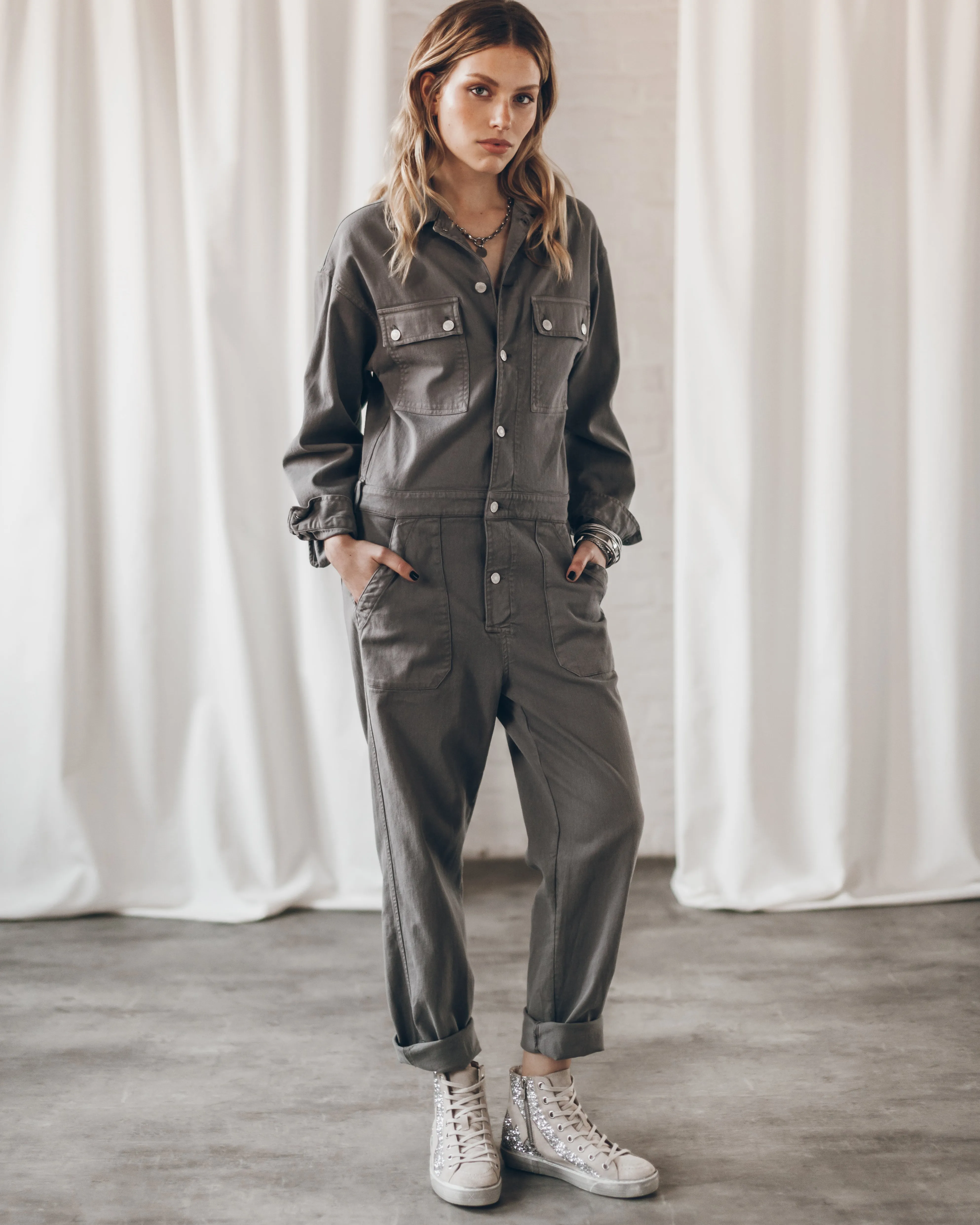 Certainly! Heres an optimized product title with modifiers:  
**Stylish and Versatile Stone-Colored Jumpsuit for Everyday Elegance**